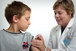 child receiving covid-19 vaccine