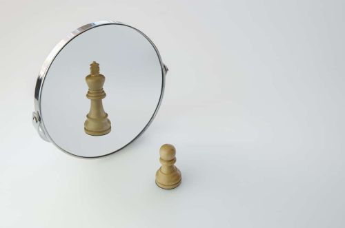 Chess Pawn imagining itself as a King, pawn in a Mirror being a king