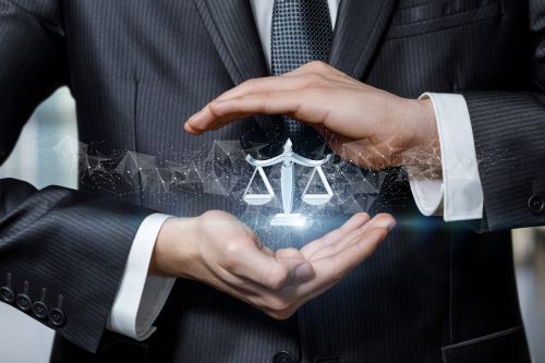 Hands protect by gesture the scales of justice icon - civil protection order concept