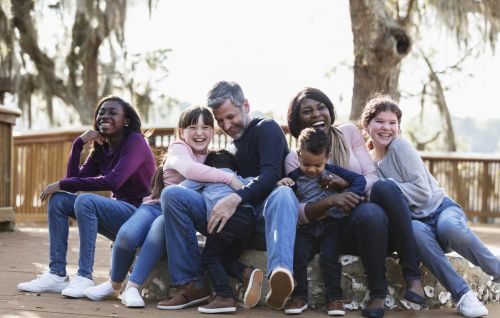 Blended family with five children outdoors at a park