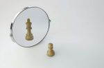 Chess Pawn imagining itself as a King, pawn in a Mirror being a king
